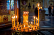 © EdNurg - Candles burn in Church