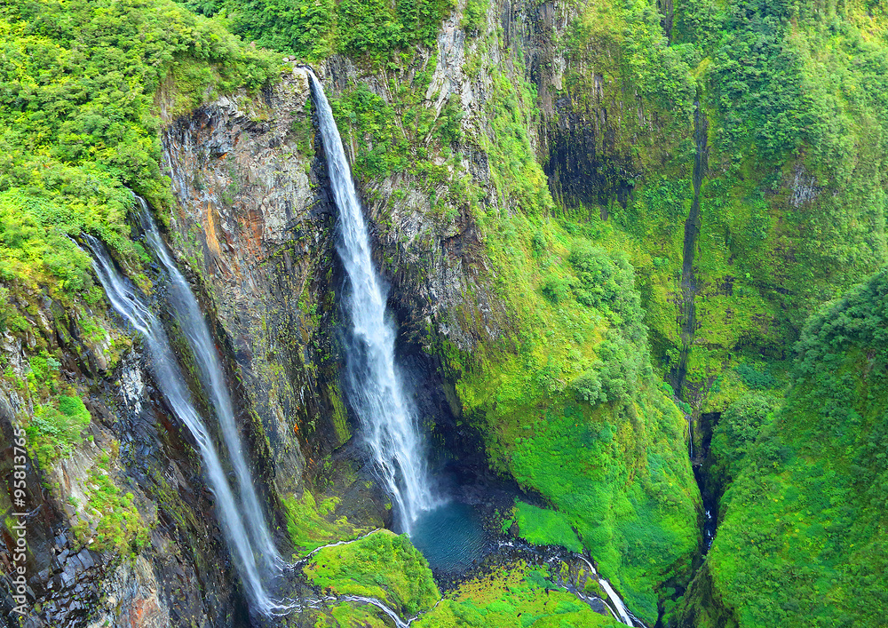 Aerial view to waterfall in rainforest. Cirque Salazie, Reunion Island. - obrazy, fototapety, plakaty 