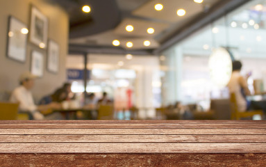 Empty wood table top with restaurant blur with bokeh background,Product display template