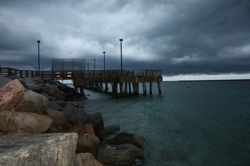 Sticker - a pier on a stormy day
