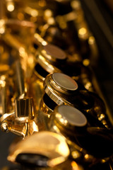 Poster - Detail valves saxophone closeup in golden colors