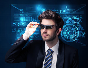 Poster - Young man looking with futuristic smart high tech glasses