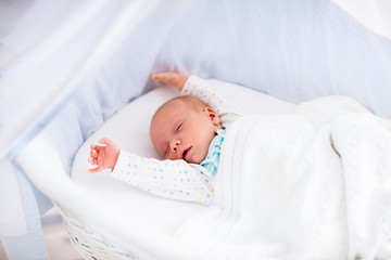 Wall Mural - cute newborn baby in white bed