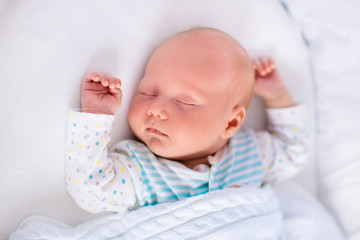 Wall Mural - cute newborn baby in white bed