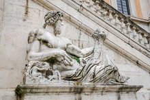 Statue On The Fountain In The Square Del Campidoglio Of Rome, Capital Of Italy