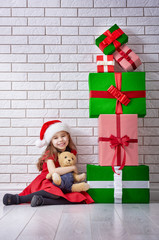 Wall Mural - little girl with Christmas gifts