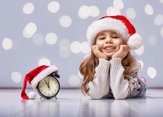 Wall Mural - child in a Christmas hat