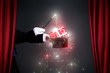 © luckybusiness - Magician hand with magic wand making Christmas  gift