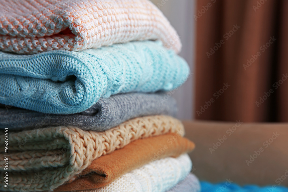 Knitted clothes on a sofa