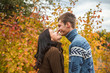© toomler - A loving couple kissing in autumn park outdoors