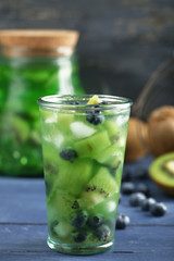 Sticker - Kiwi and Blueberry cocktail on wooden background