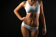 © Africa Studio - Slim female body in nice white lingerie on black background
