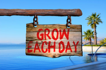 Grow each day motivational phrase sign