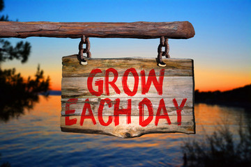 Grow each day motivational phrase sign
