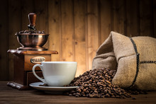 Still Life With Coffee Beans And Old Coffee Mill On The Wooden Background