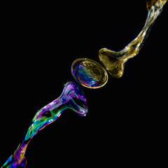 multi-colored bubbles of liquid interconnecting with one another