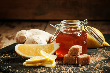 Sticker - Ingredients for ginger tea: sweet honey in a jar, lemon slices,