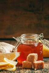 Sticker - Ingredients for ginger tea: sweet honey in a jar, lemon slices,