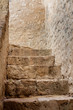 Stone Stairway / An interesting view of a stone stairway in a historical church with light coming in from the open ceiling