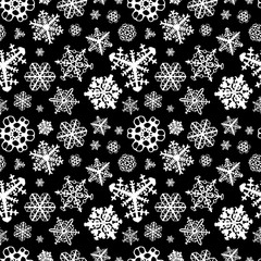 different white snowflakes on black background seamless pattern