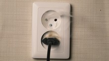 Fire In European Style  Wall Socket. Concept: House Insurance, The Insured Event, The Cause Of Fire