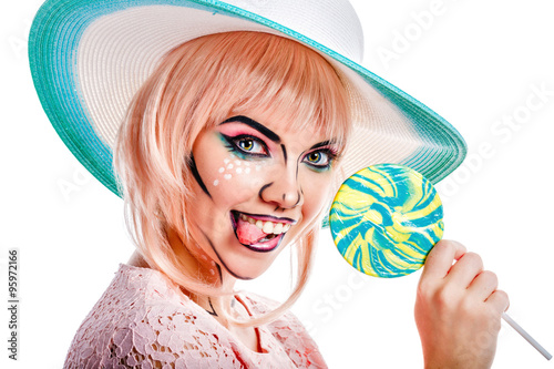 Fototapeta do kuchni Girl with makeup in the style of pop art, hat and lollipop.