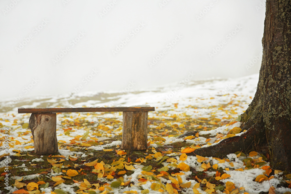 Old wooden bench in mountains