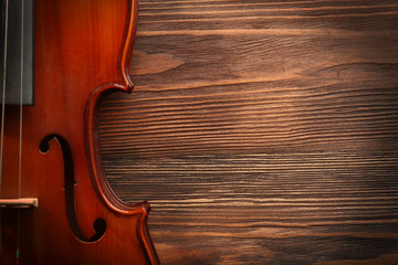 Wall Mural - Violin on wooden background