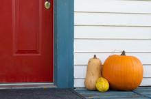 Pumpkin And Gourds On The Front Porch Of A House At Halloween And Thanksgiving