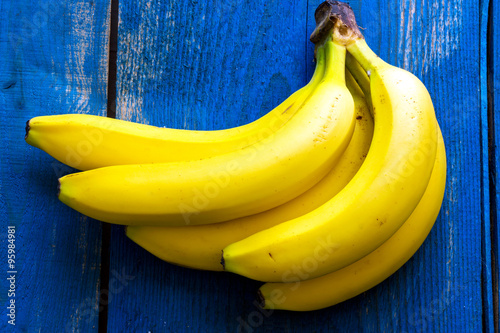 Fotografie, Tablou Fresh bananas on wooden background