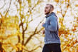 © baranq - Young athlete running during autumn