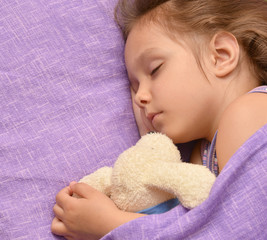 Wall Mural - Little girl sleeping with  toy