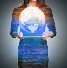 Poster - Close up Girl holding a digital globe over tablet