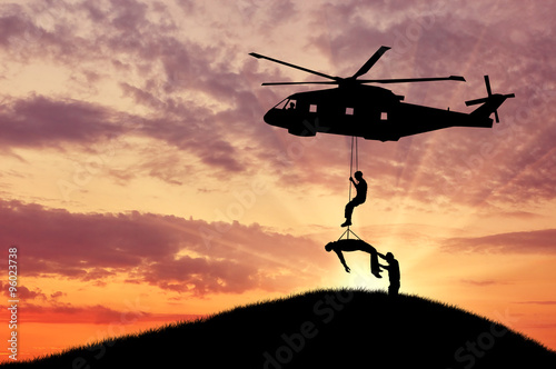 Cuadros en Lienzo Silhouette helicopter evacuated person