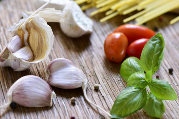 Wall Mural - garlic, mint, cherry tomatoes and spaghetti