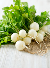 Wall Mural - white radishes on wooden surface