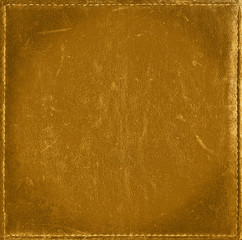 Wall Mural - Golden shiny grunge background from distress leather texture