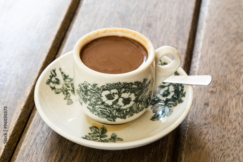 Traditional oriental Chinese coffee in vintage mug and saucer, on wooden  table top Stock Photo | Adobe Stock