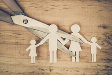 Scissors Cutting Paper Cut Of Family / Broken Family Concept / Divorce