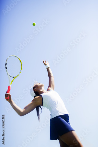 Fotografia, Obraz Beautiful female tennis player serving