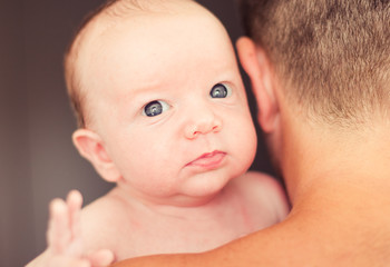 Wall Mural - Father holding newborn baby.