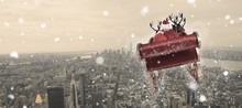 Composite Image Of Santa Flying His Sleigh