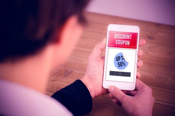 Poster - Composite image of businesswoman using phone at desk