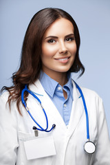 Canvas Print - smiling female doctor, on grey