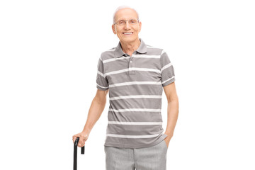 Poster - Senior in polo shirt holding a cane and posing