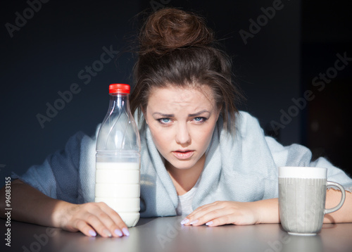 Fotografie, Obraz Unhappy tired woman with head on the table