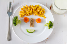 Fruits And Vegetables Arranged To Look Appealing To Kids In Funny Face