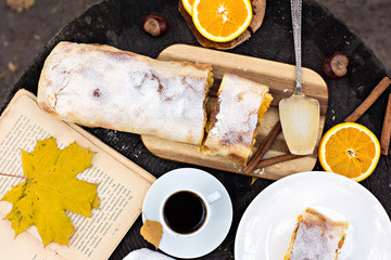 Strudel with custard and orange. Christmas Stollen. Christmas table decoration.