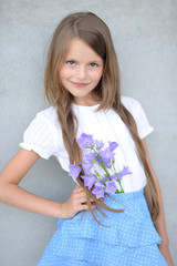 Wall Mural - portrait of little girl outdoors in summer