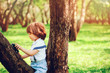 © mashiki - cute toddler boy playing with toy car on summer walk